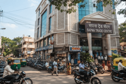 Shoppers browsing goods inside Sapna Trade Centre market